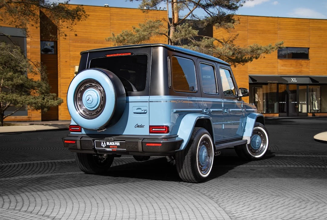 Blue Mercedes, a rear three-quarter view